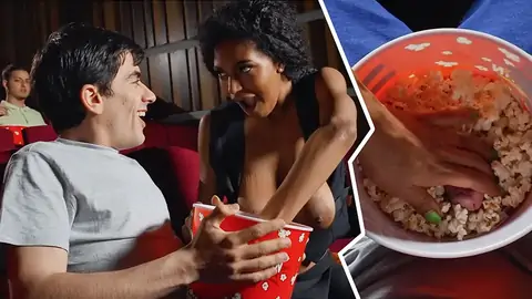 Public bi-racial in the cinema with an ebony